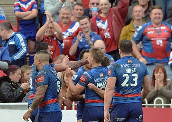 Try: Wakefield players and fans celebrate Sam Williams's touchdown.