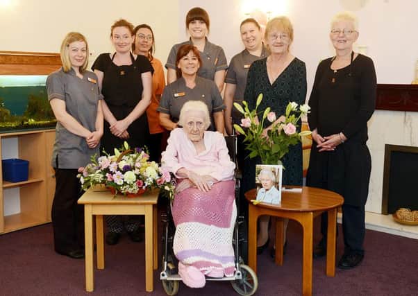 Annie Hill Pictured with staff at Priory Gardens Care Home, Pontefract