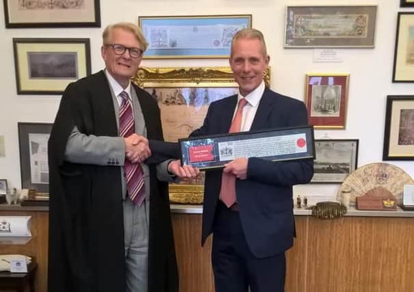 Clive Johnson (right)  receives the Freedom of London Award.