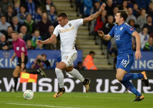 Jay-Roy Grot lines up a shot as Harry McGuire closes in during Leeds United's Carabao Cup tie at Leicester City. Picture: Bruce Rollinson