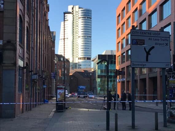 Police at the crime scene in Leeds city centre. Photo: Andy Bell.