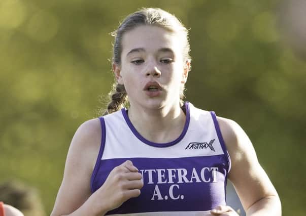 Ponntefract Athletics Club's Niamh Atkinson on her way to finishing 30th out of 69 in the girls under 13s race.
