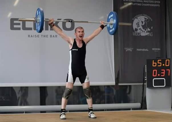 Weightlifting champion Martyn Riley in action.