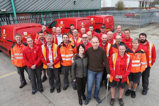 A group of 40 postmen are doing a sponsored walk for retired colleague Peter Carey who has been diagnosed with Motor Neurone Disease, pictured with Diane Carey