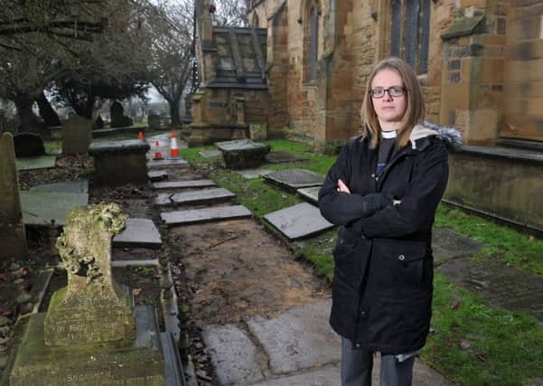 Rev Sarah Hancox appealing for the public's help in finding Yorkshire stone paving stolen from its St Oswalds churchyard in Methley. Picture Tony Johnson