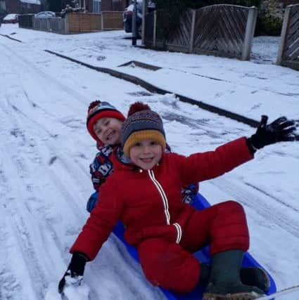 Lee Thompson sent this picture of his sons, Leon, six, and Theo, three  enjoying the snow in Wrenthorpe.