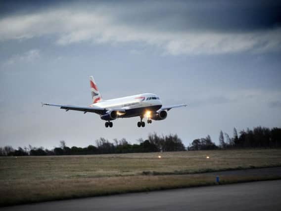 A BA flight lands at Leeds Bradford Airport.