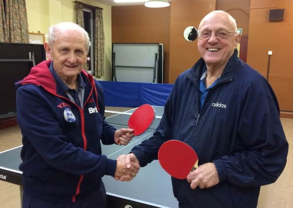 Local table tennis players include 79-year-old Keith Powell (left) and 85-year-old Marcus Hookham (right).