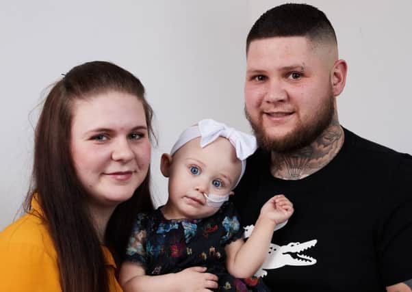 Little Ivy-Louise Gawthorpe with her parents, Kerri-Lee and Jamie .