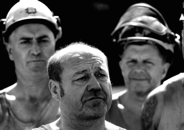 Miners at Kellingley Colliery during a press conference regarding the updated future of the pit. The workers buy out propsal has effectively been scuppered by UK Coal, meaning the coal mine will definately close.
p307c429