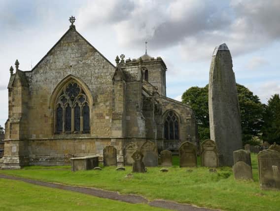 The All Saints Church and Monolith in Rudston