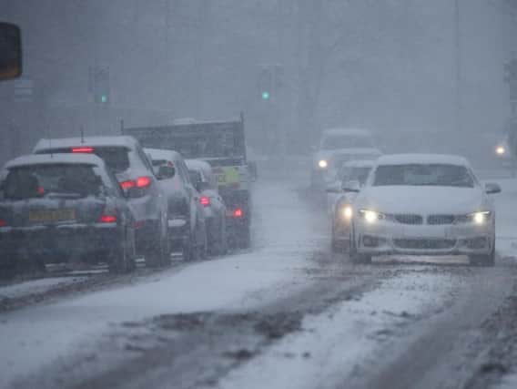 Cars navigate through the snow earlier this month. Picture by Charles Purvey.