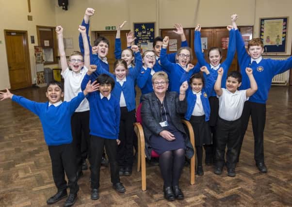 Headteacher Margaret young with pupils.