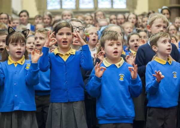 Ossett schoolchildren singing at Holy Trinity Church to celebrate Easter