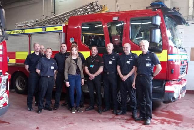 Lou Evans and her rescuers at Leeds Fire Station.