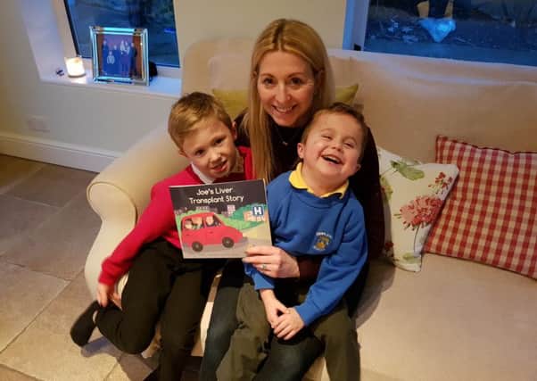 Published: The book has been welcomed by Emma McDonald, pictured with sons Louie and Freddie.