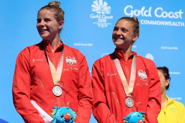 England's Alicia Blagg (right) and Katherine Torrance with their silver medals for the Commonwealth Games Women's Synchronised 3m Springboard Final. PIC: Mike Egerton/PA Wire
