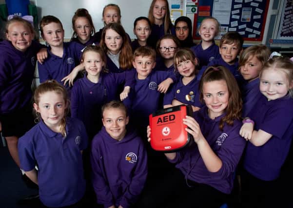 Children from Methley Primary school have raised money for a defibrillator.