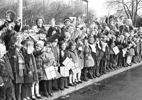 Children lined the streets to welcome the Queen in 1982.