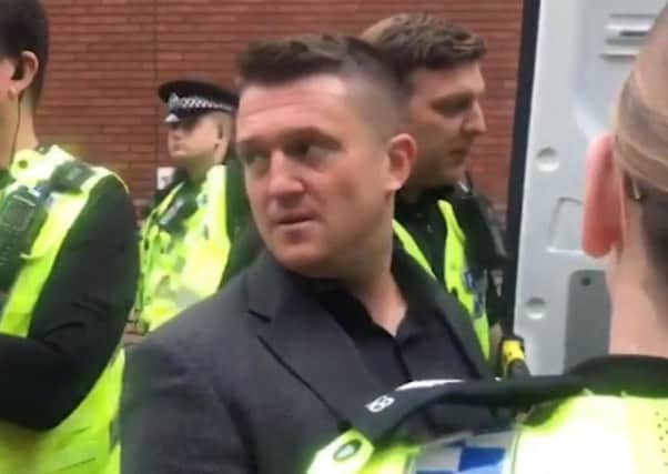Tommy Robinson outside Leeds Crown Court. A screengrab from a video taken of Robinson as he was arrested by police.